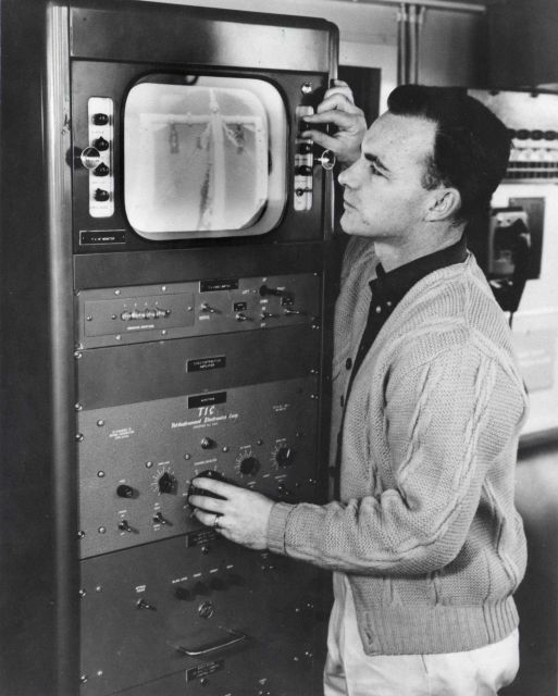Jim Crossen looking at the closed circuit TV master control located in the wheel house of the ALBATROSS IV Picture