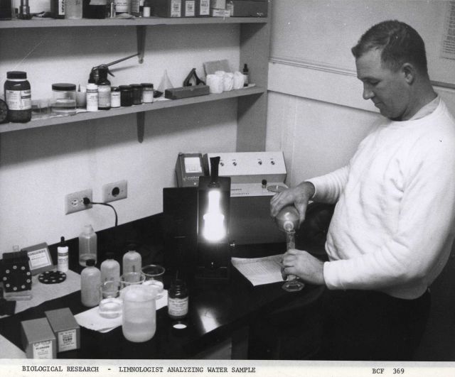 Biological research - a limnologist analyzing water samples. Picture