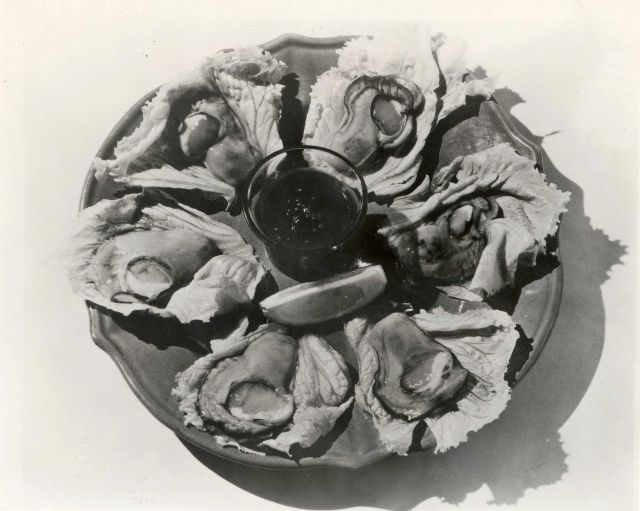 Plate of oysters on the half-shell, using lettuce leaf for cup Picture