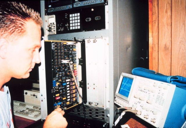 Jim Barr working in electronics workshop Picture