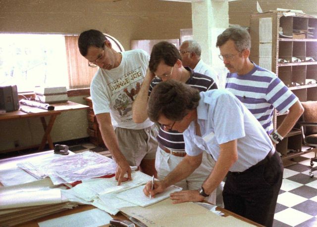 Frank Marks, James Franklin, Bob Burpee, and Hugh Willoughby plan NOAA research flights into Hurricane Gabrielle. Picture