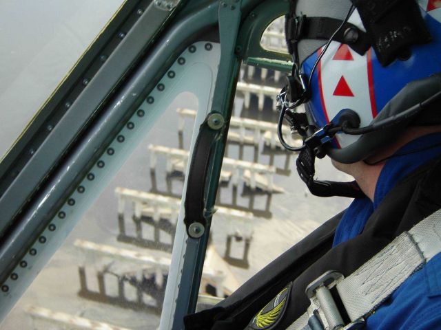 Post-Katrina damage evaluation on NOAA Helicopter N61RF, NOAA's last helicopter. Picture