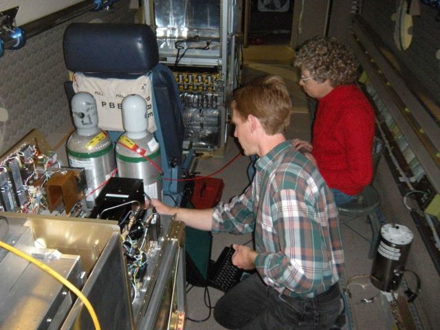 HIPPO researchers Ryan Spackman and Laurel Watts preparing for mission on NCAR Gulfstream-V aircraft. Picture