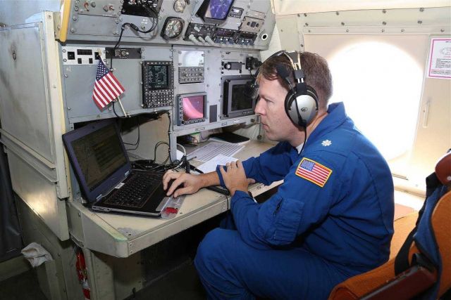 Navigator Commander Pete Siegel, NOAA Corps, in NOAA P-3 N42RF flight into Hurricane Edouard. Picture
