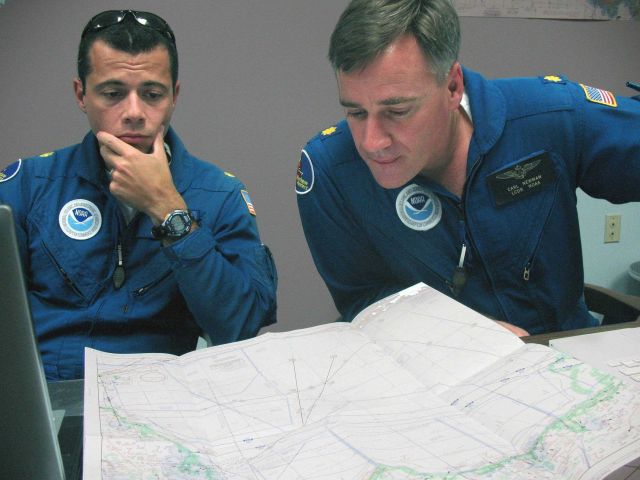 NOAA Corps officers planning mission into hurricane Ike. Picture