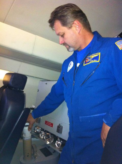 NOAA Engineer John Hill deploys a dropsonde from the G-IV during a February 2013 mission over the North Pacific Ocean. Picture