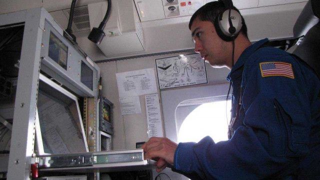 Flight Meteorologist Ian Sears on the NOAA Gulfstream IV Picture