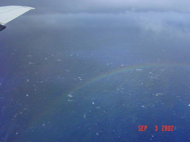 Rough seas and a rainbow seen from 