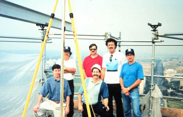 Global Positioning System (GPS) surveyors on top of Capitol Building Picture