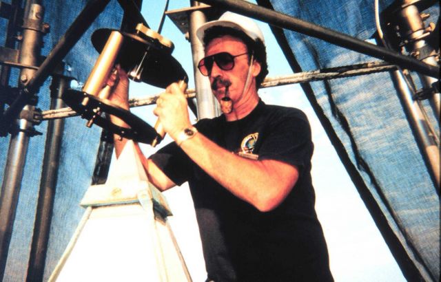 Roy Anderson of the National Geodetic Survey is setting up the mounting device manufactured by the National Institute of Standards and Technology for  Picture