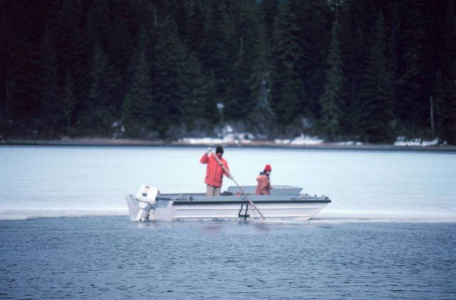 Geodetic survey crew attempting to break through ice to get ashore. Picture