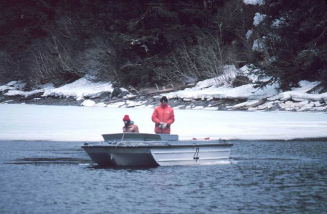 Geodetic survey crew attempting to break through ice to get ashore. Picture