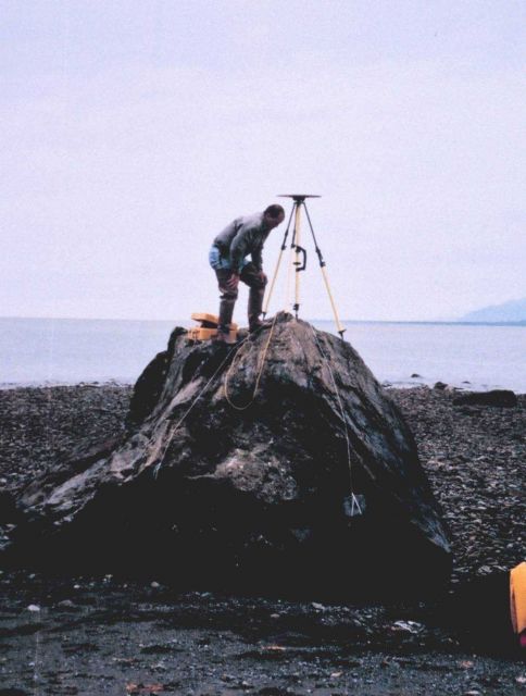Mike Aslaksen setting up GPS receiver over tidal bench mark. Picture