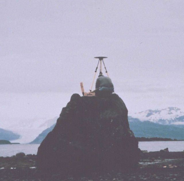 Mike Aslaksen setting up GPS receiver over tidal bench mark. Picture