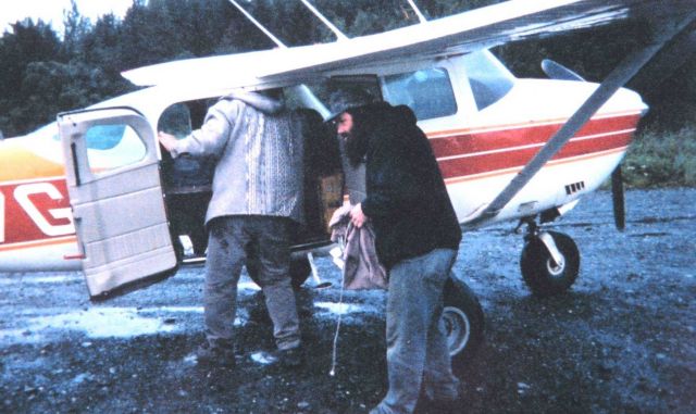 Unloading gear from bush aircraft used for transportation from Yakutat. Picture