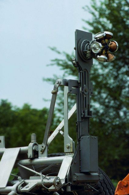 Movable arm at top end of TMT used to center light and/or mirror over survey mark. Picture