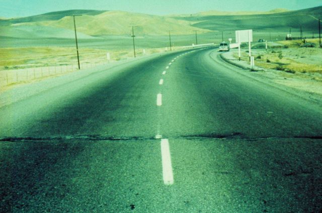 Earthquake movement as manifested by offset in center line of roadway. Picture