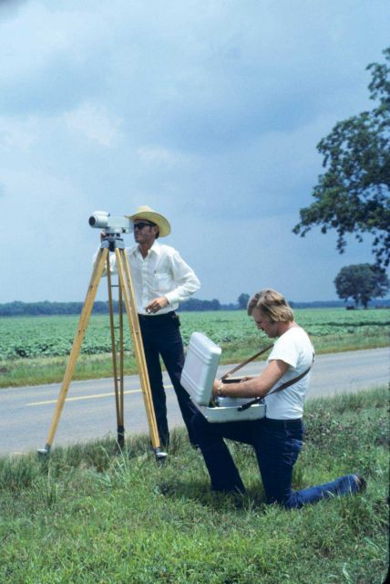 James Lindly observing and Leo Gittings recording leveling observations. Picture