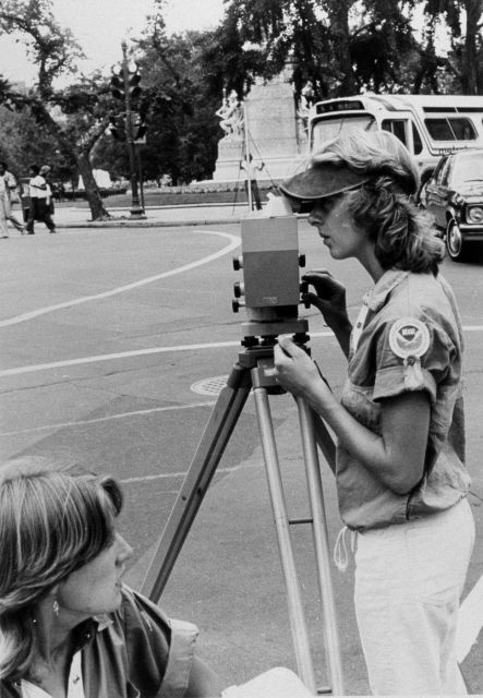 Anita Whitis, crew chief and instrument operator, reading rod during White House leveling project Picture