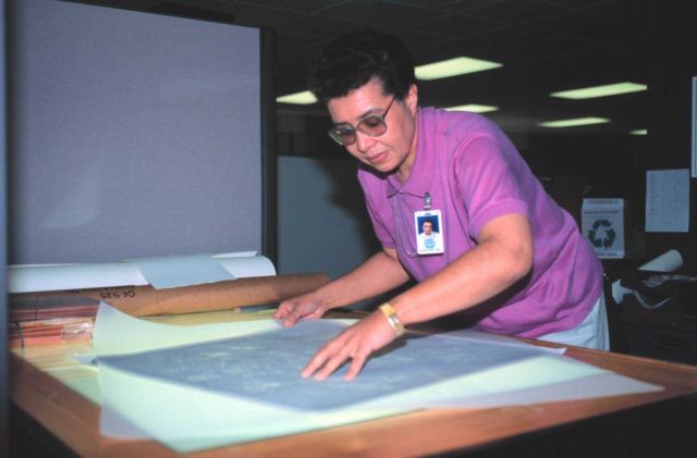 Helen Sharpe-Williams, a cartographer with the National Geodetic Survey Remote Sensing Division working with aerial photographs. Picture