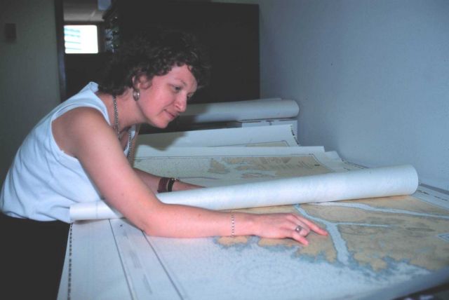 Jessica Durley, a cartographic technician with the National Geodetic Survey, working with nautical charts. Picture