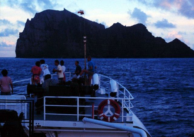 Science party on the bow taking in the sights while approaching Necker Island on the NOAA Ship TOWNSEND CROMWELL Picture
