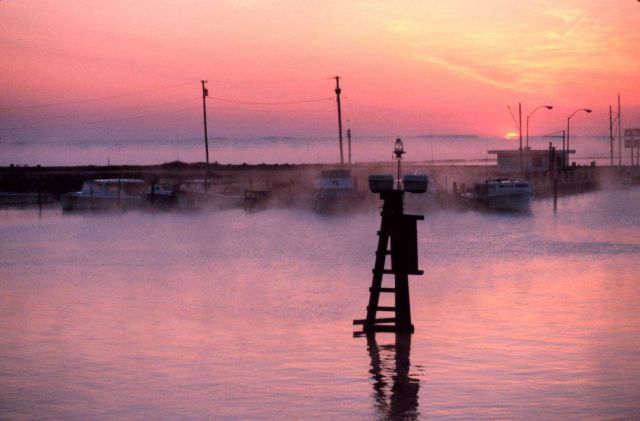 Advection fog and the morning sun coming up over the Chesapeake Bay and Fishing Creek. Picture