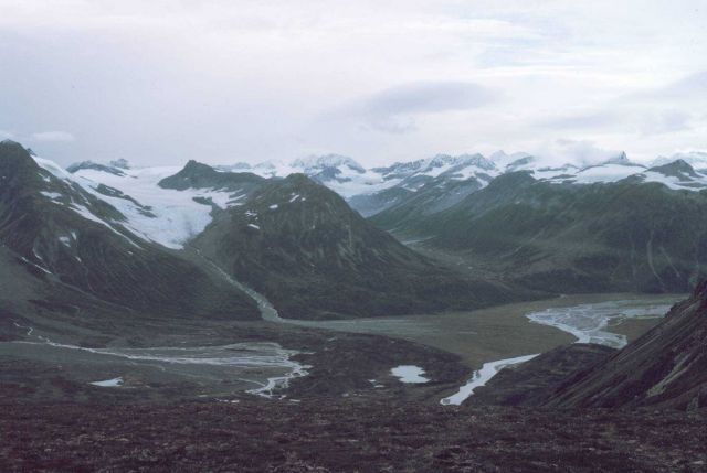 Mountains, glacial valleys, and a river valley on a gray day in Redoubt Volcano area. Picture