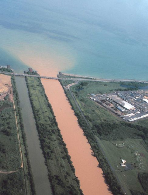 A heavily silted river enters the ocean near San Juan Picture