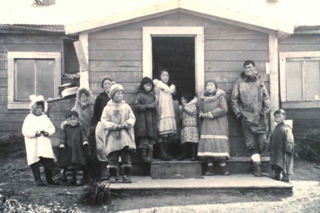 Eskimos visiting at Paul Evanoff's house. Picture