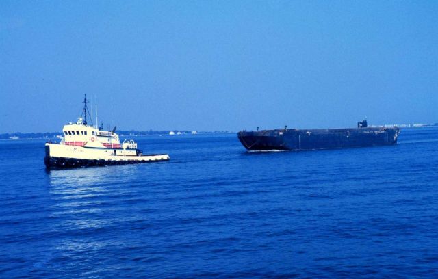 A seagoing tug towing a barge in Charleston Harbor. Picture