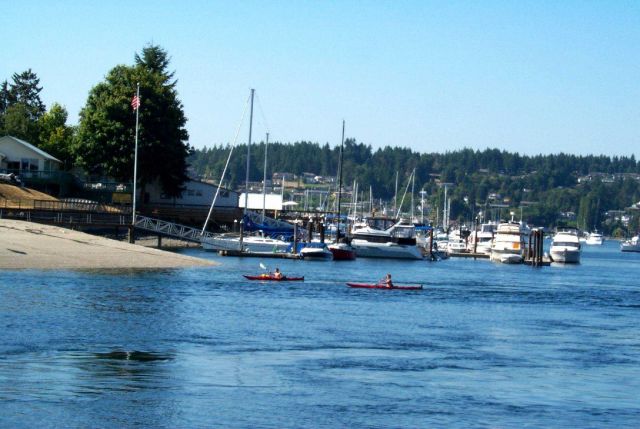Kayakers enjoying a quiet day inside of Gig Harbor. Picture