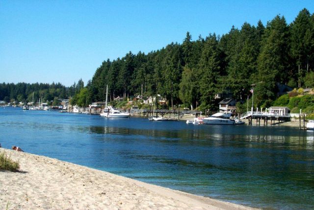 A view of private boat docks from one of the few sandy beach areas in the Gig Harbor area. Picture