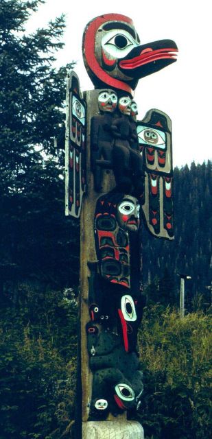 Raven and Sun Totem at Saxman Totem Park outside of Ketchikan. Picture