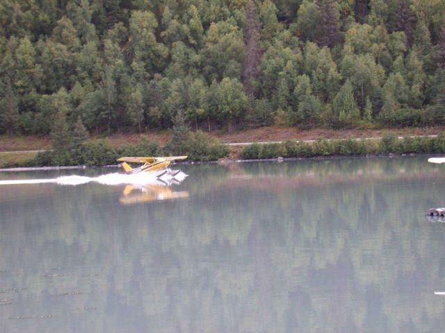 Float plane landing in glacier melt lake. Picture