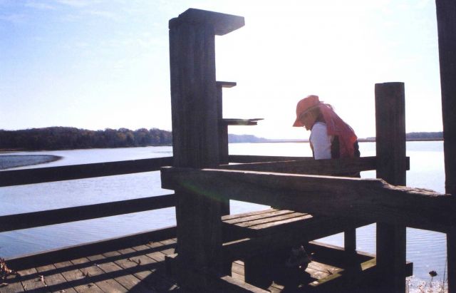 Catching a quiet moment on a warm fall afternoon at a public park fishing pier. Picture