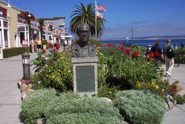 A bust of John Steinbeck near waterfront shops along Cannery Row. Picture