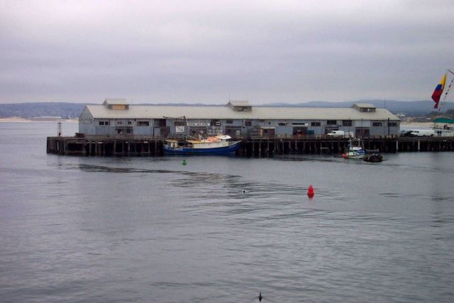 A scene reminiscent of a Steinbeck novel - the fishing vessel LUCKY tied up at a commercial wharf at Monterey. Picture