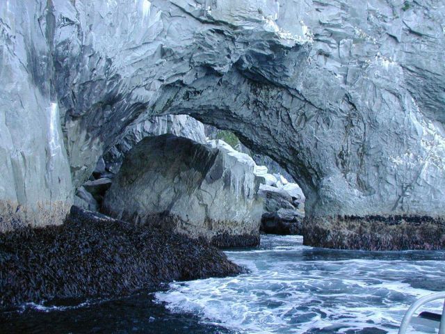 Kuiutka Bay arches on Alaska Peninsula out past Semidi Islands. Picture