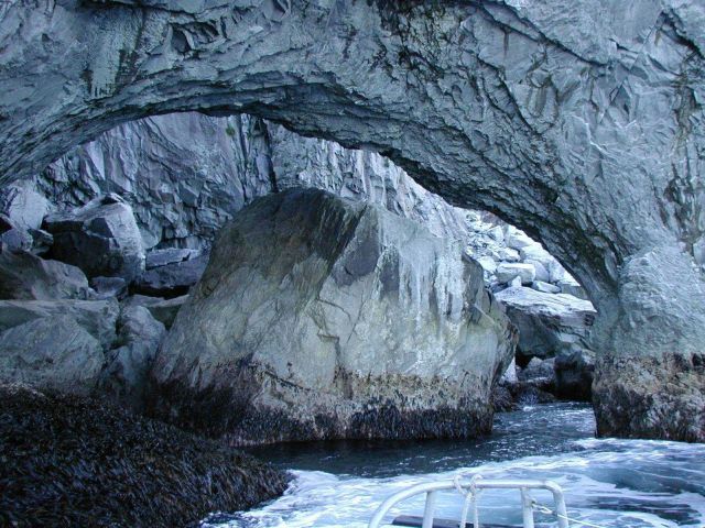 Kuiutka Bay arches on Alaska Peninsula out past Semidi Islands. Picture