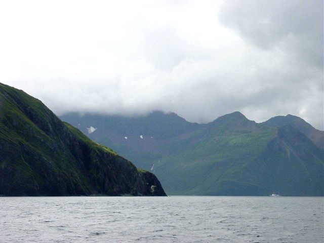 NOAA Ship RAINIER dwarfed by the magnificence of Kuiutka Bay. Picture