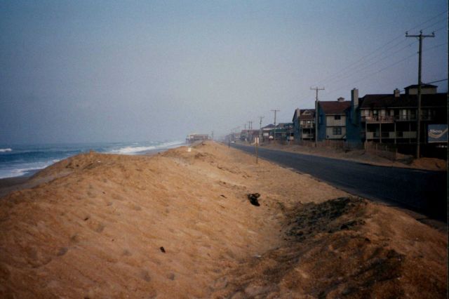 An encroaching sea with increasing sea level relentlessly attacks a barrier island. Picture