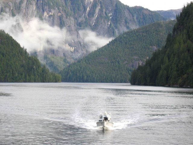 NOAA Ship RAINIER survey launch AR3 dwarfed in the magnificence of the Rudyerd Bay area Picture