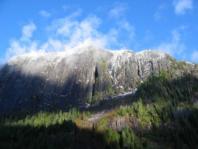 Sprinkles of snow dot precipitous cliffs. Picture