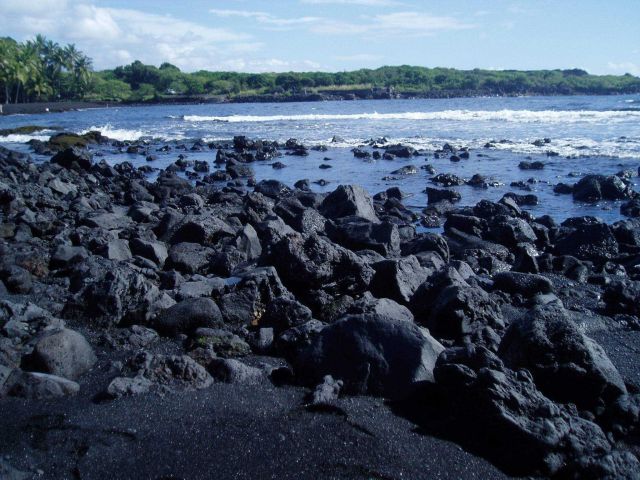 A recent lava flow forms the beach on the southeast side of the big island. Picture