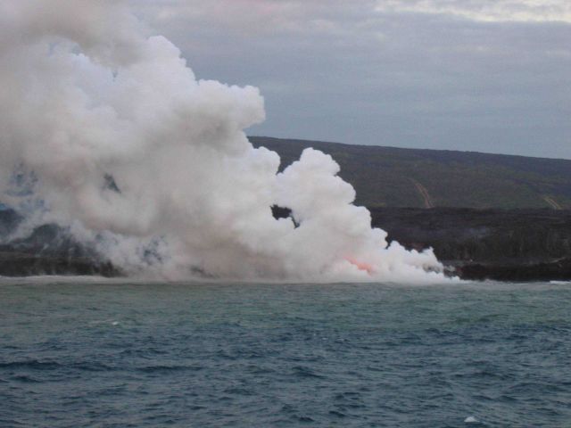 Lava flow entering the sea on SE coast of Hawaii. Picture