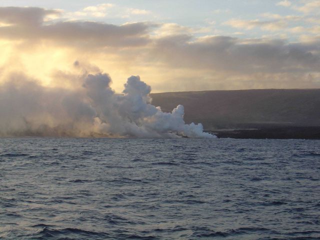 Lava flow entering the sea on SE coast of Hawaii. Picture