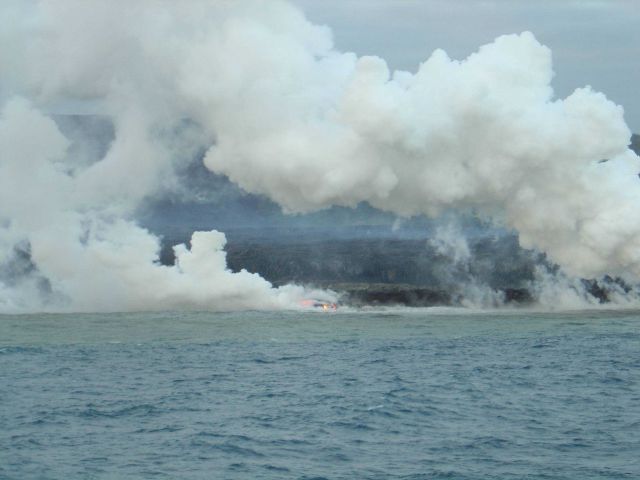 Lava flow entering the sea on SE coast of Hawaii. Picture