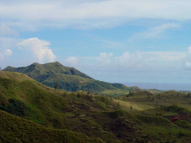 Mountains of Guam and a military antenna farm. Picture