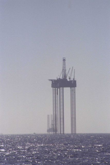 Jack up oil and gas drilling rigs anchored off Cameron, Louisiana. Picture